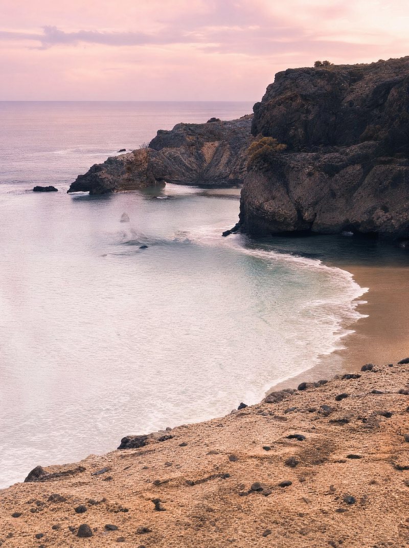 A quiet beach cove at dusk